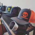 A rack of hats with different designs on them.