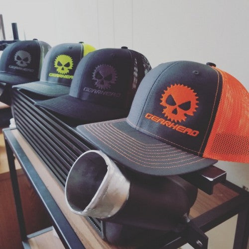 A rack of hats with different designs on them.