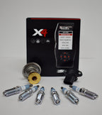 A set of new spark plugs and an electronic device.