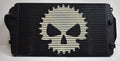 A black and white skull with a bicycle chain on it.