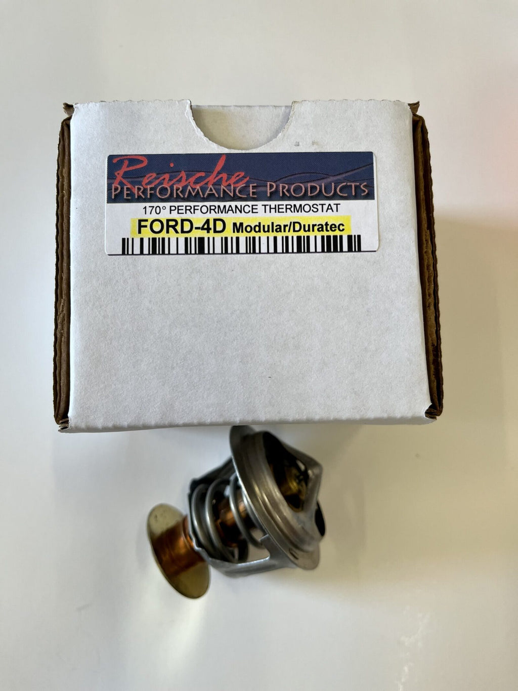 A box of the engine coolant thermostat