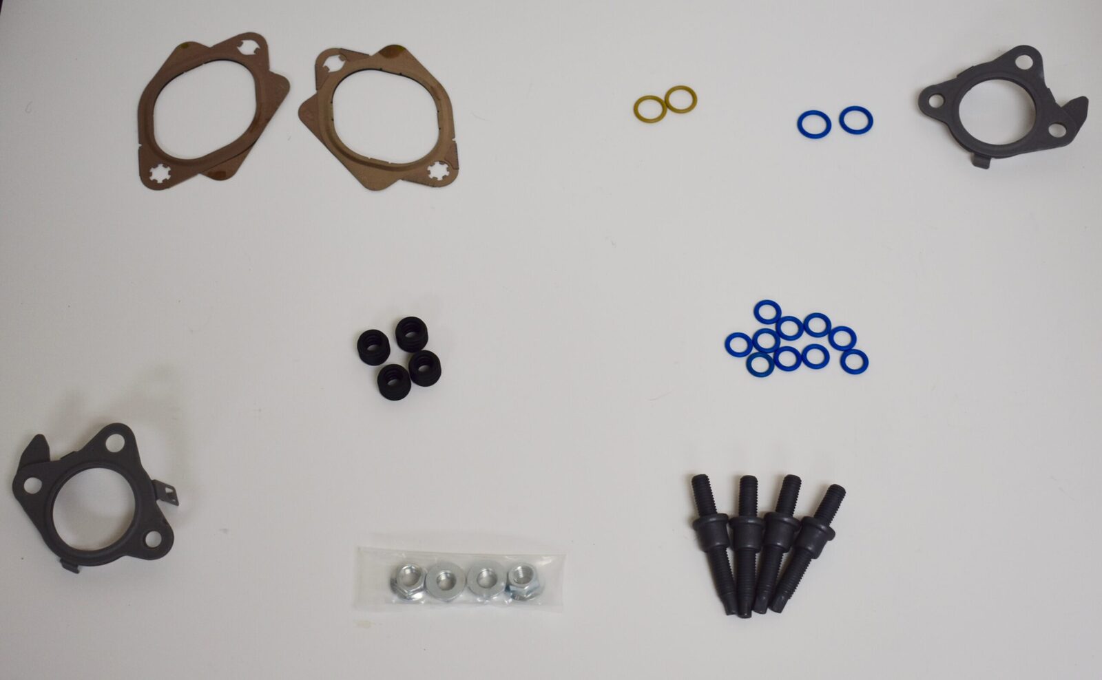 A white table with some parts of the same type