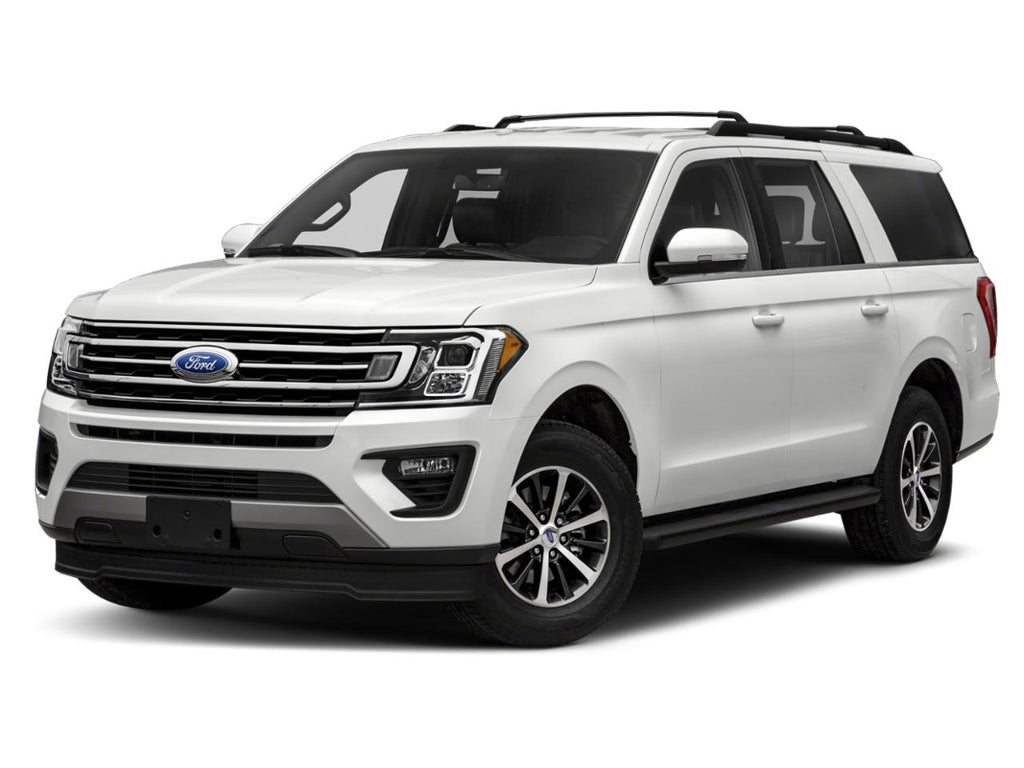 A white suv is parked in front of the camera.