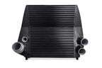 A black radiator is shown with two pipes.
