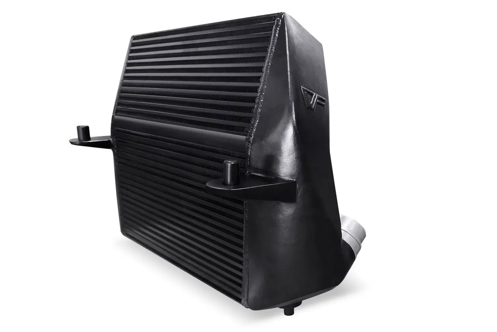 A black radiator is sitting on top of the floor.