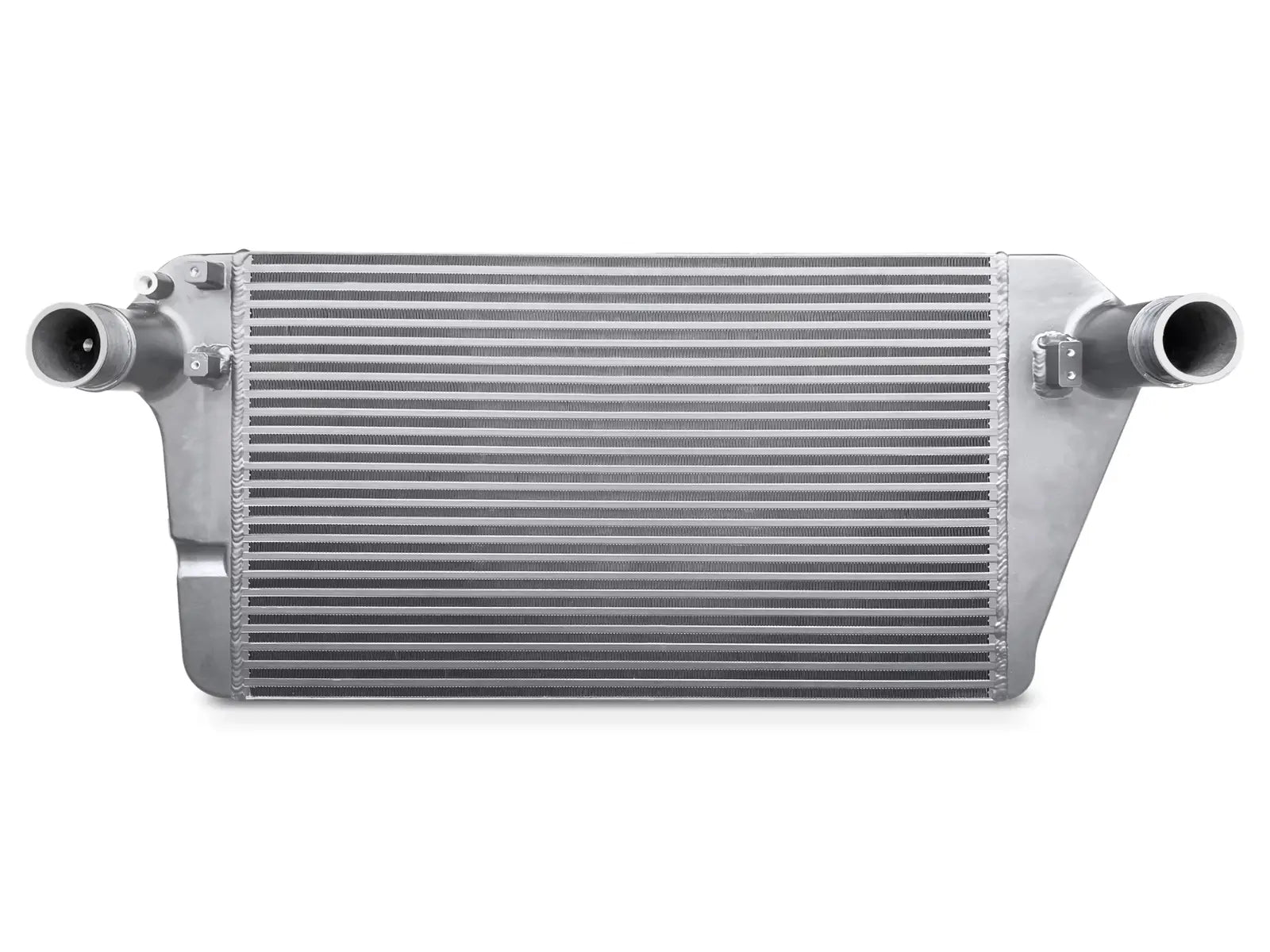A silver radiator on top of a white wall.