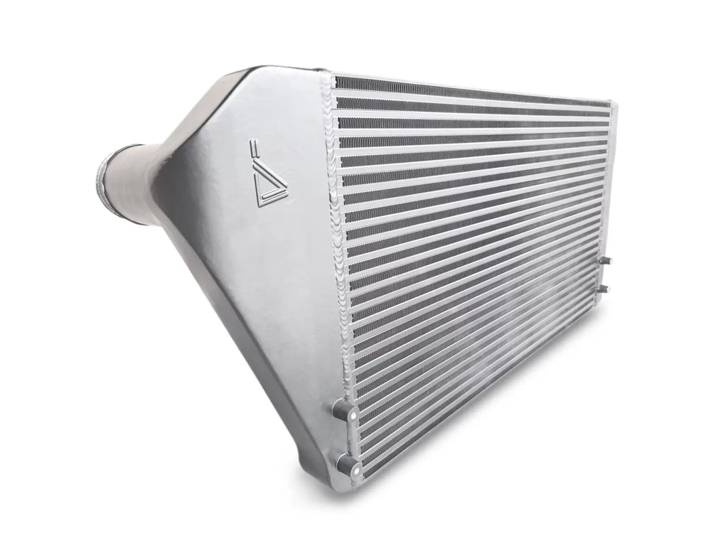 A silver radiator sitting on top of a white floor.