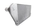 A silver radiator sitting on top of a white floor.