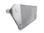 A silver radiator sitting on top of a white floor.