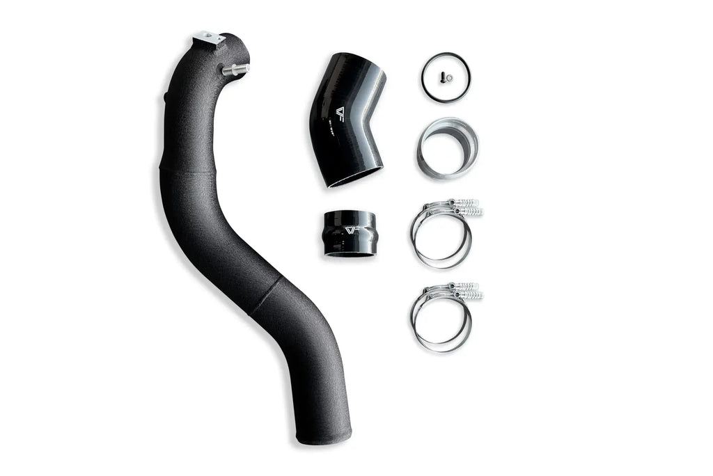 A black hose and its parts are laying on the ground.