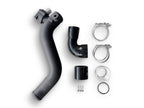 A black hose and its parts are laying on the ground.