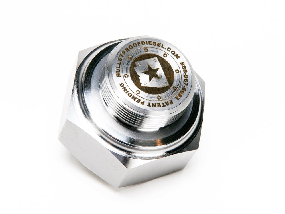 A silver nut with a star on it.