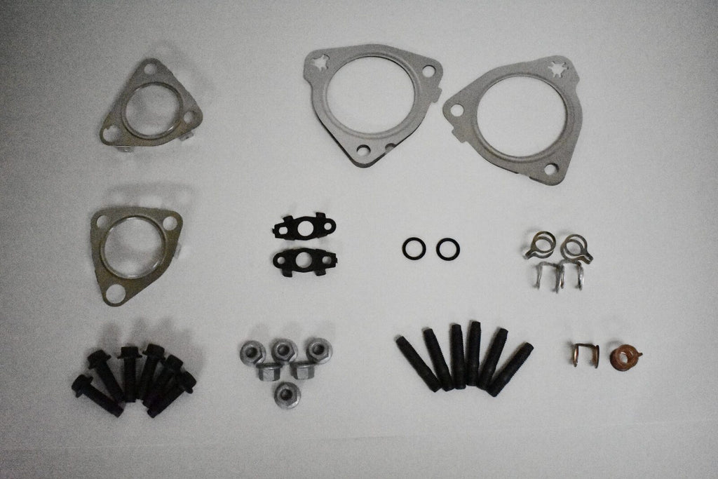 A set of parts for the exhaust manifold.
